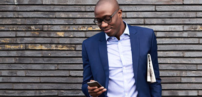 Business man using his cellphone to message his doctor on MyChart