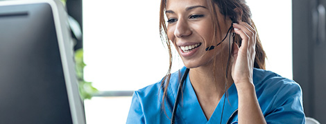 A nurse talking to a patient via headset.