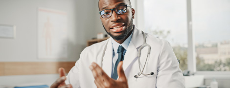 A physician on camera talking to a patient.