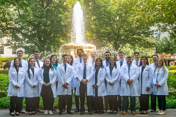 image of AHN Pharmacy Residents in front of the Northeast Fountain in Allegheny Commons Park