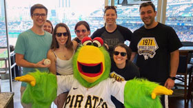 Residents posing with the the Pittsburgh Pirates mascot the Parrot