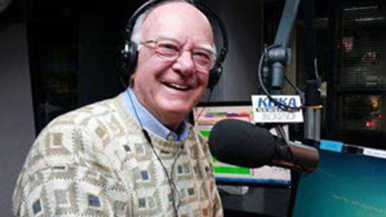 Medical Frontiers informational host in his studio, smiling and looking into the camera.