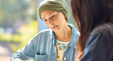 AHN cancer patient listening to her advocate