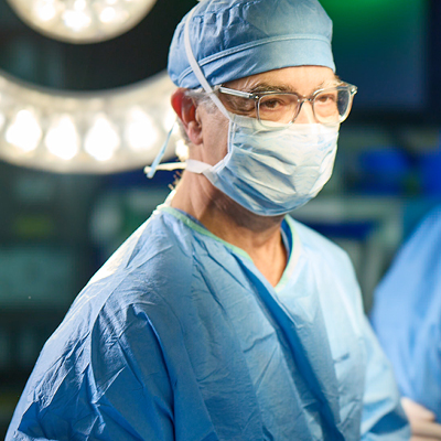 Surgeon in scrubs preparing for Kaposi Sarcoma surgery at AHN Cancer Institute