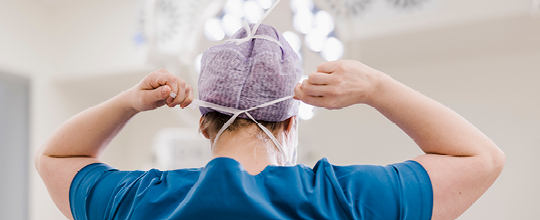 Surgical team member preparing for Kaposi Sarcoma surgery