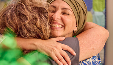 Close up of two women hugging