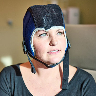 AHN patient looking off camera while wearing a medical device.