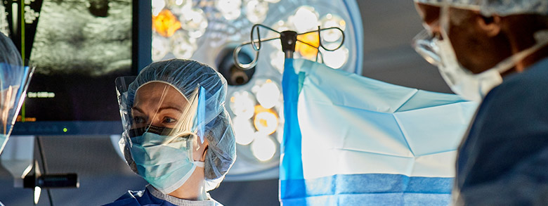 Surgeons looking at each other in an operating room 