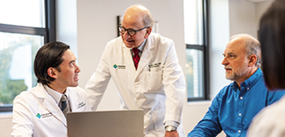 Two AHN doctors and a patient having a discussion.