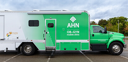 The Allegheny Health Network Mobile Clinic vehicle parked in an outdoor lot