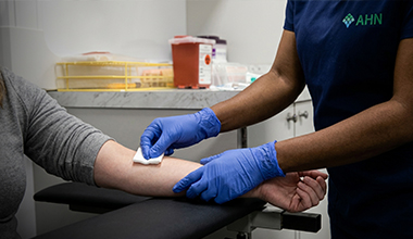 Nurse taking a blood sample from a patient