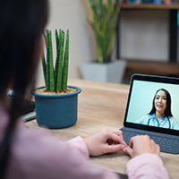 image of a woman talking to her doctor on a tablet