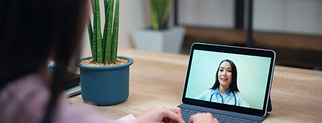 image of a woman talking to her doctor on a tablet